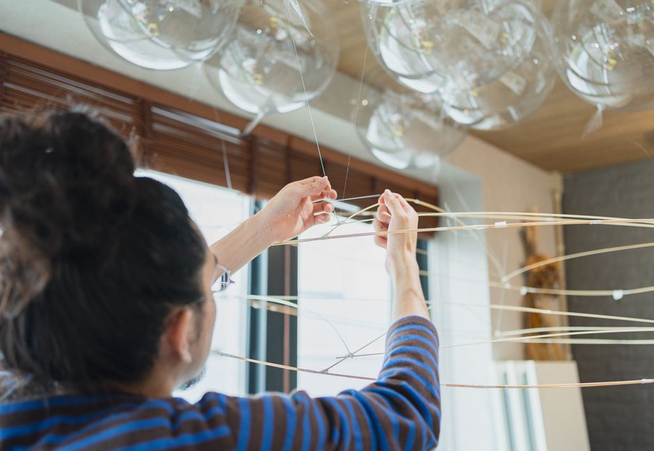 Artist working on a contemporary art installation inside a Shinjuku studio, Tokyo, Japan.